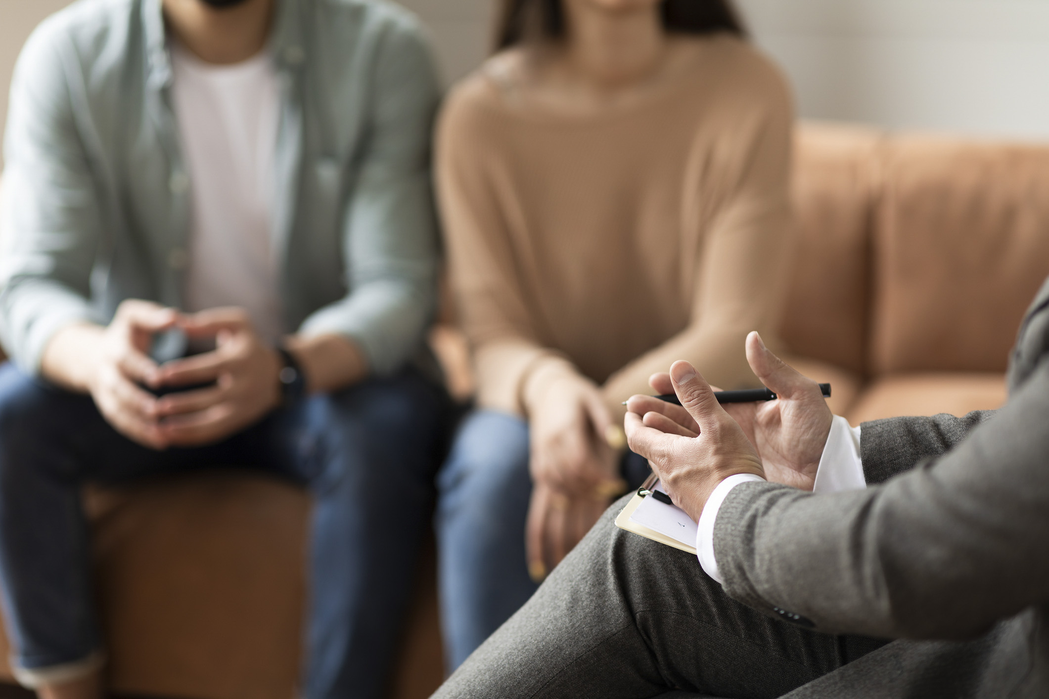 couple on couch receiving counseling