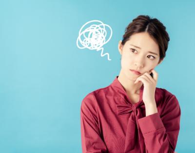 Girl thinking about future with worrisome scribble near her head