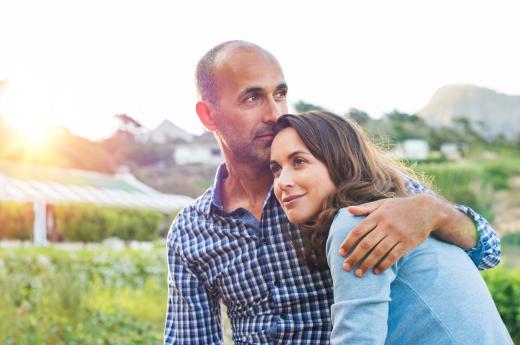 Man and woman hugging outside