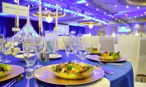 Salads are set on tables for the first course at Wine and Dine