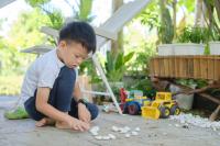 Child playing alone outside